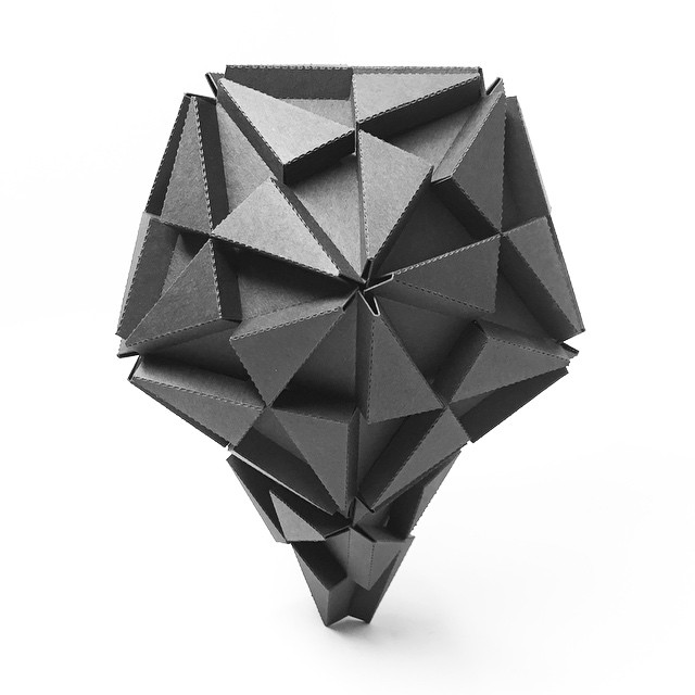 Icosahedron perched atop a tetrahedron.