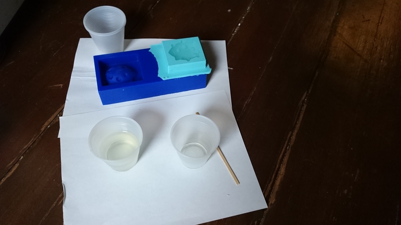 both
    the cup and the rubber mold are filled with the plastic