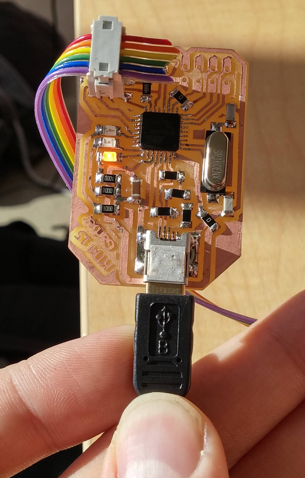 A photo of the LED on the USB board, showing that it's working
