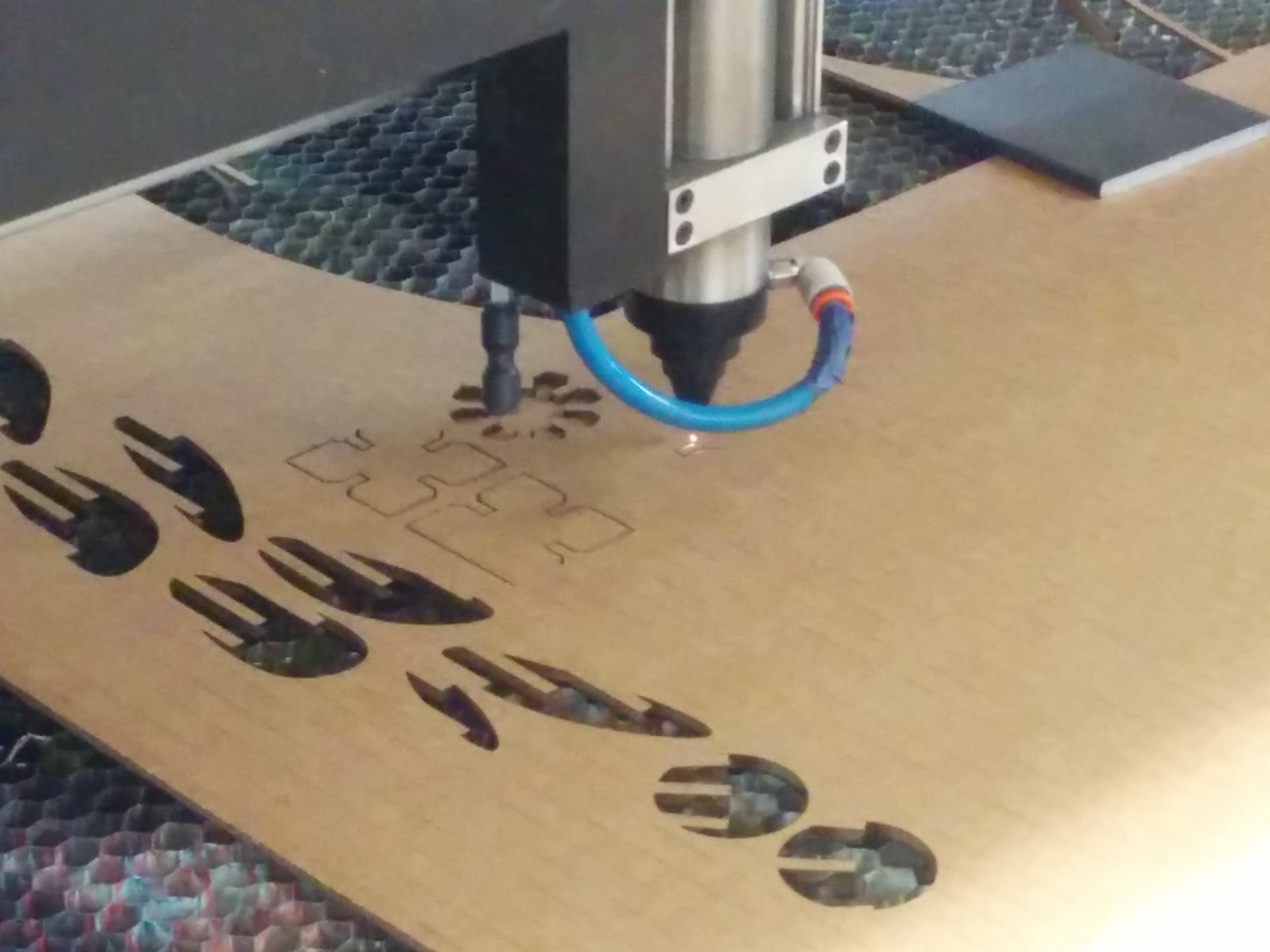 The laser cutter in action.