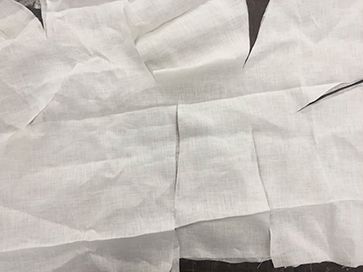 White fabric with incisions on the sides