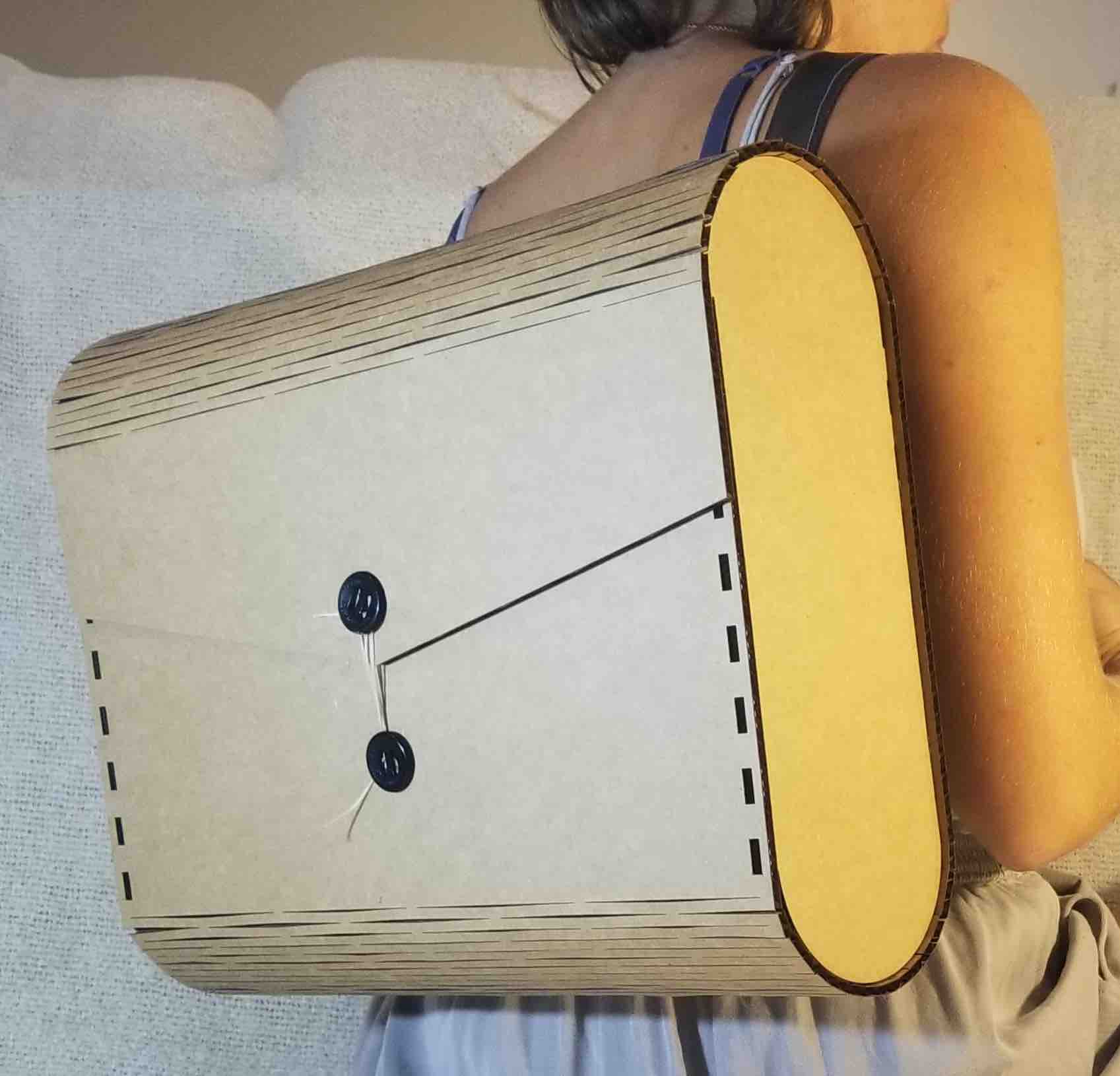 Finished backpack on my back, with button closures added.