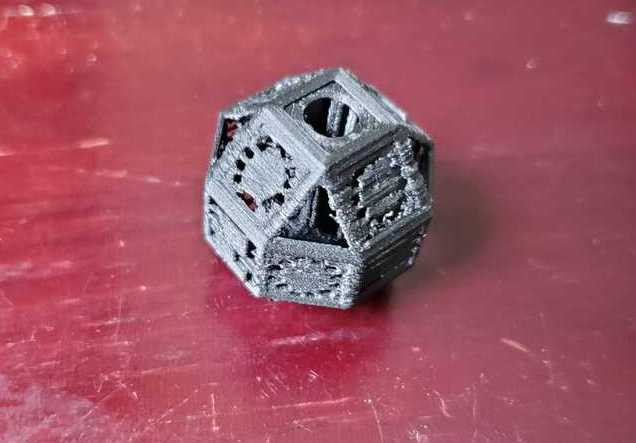 The small piece, printed in a different 3D printer