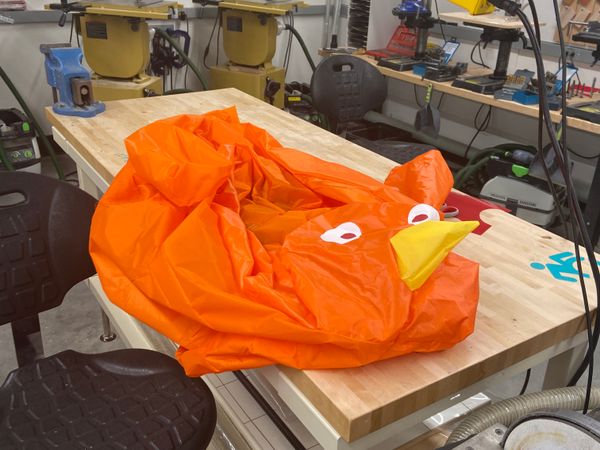 Giant orange inflatable buff pigeon