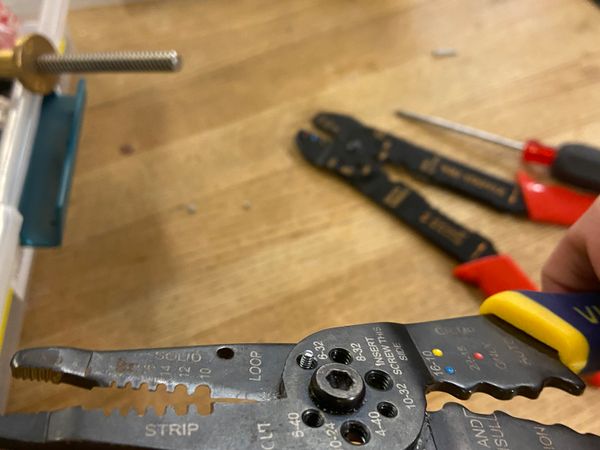 Cutting a screw with a wire cutter
