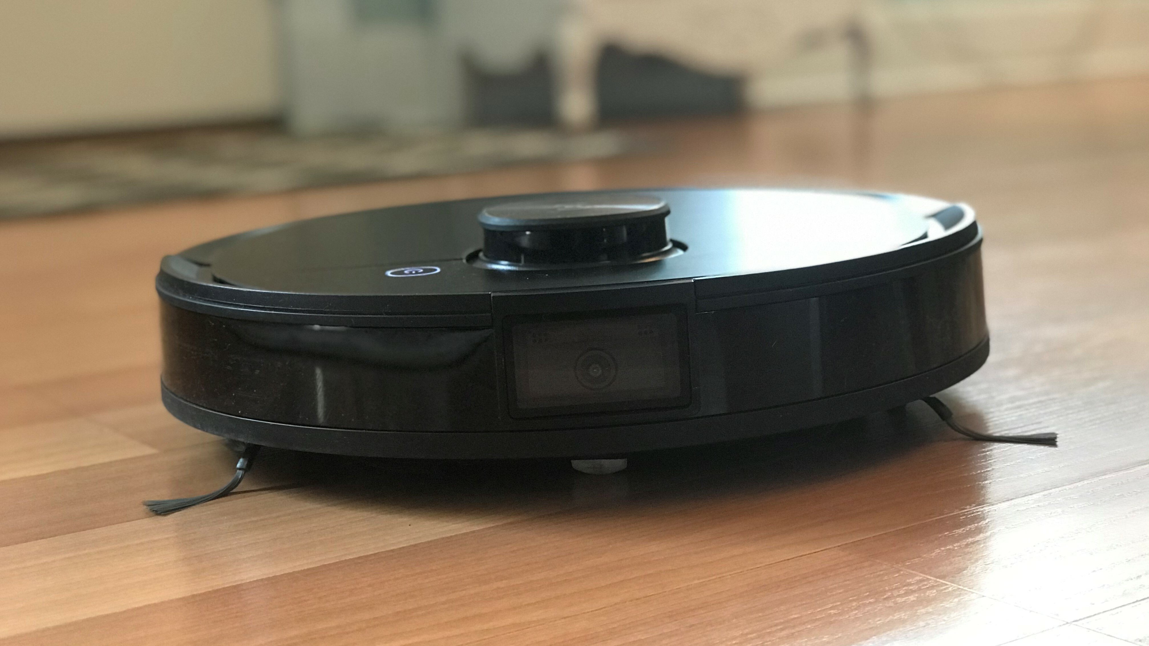 Image of a black robot vacuum cleaner