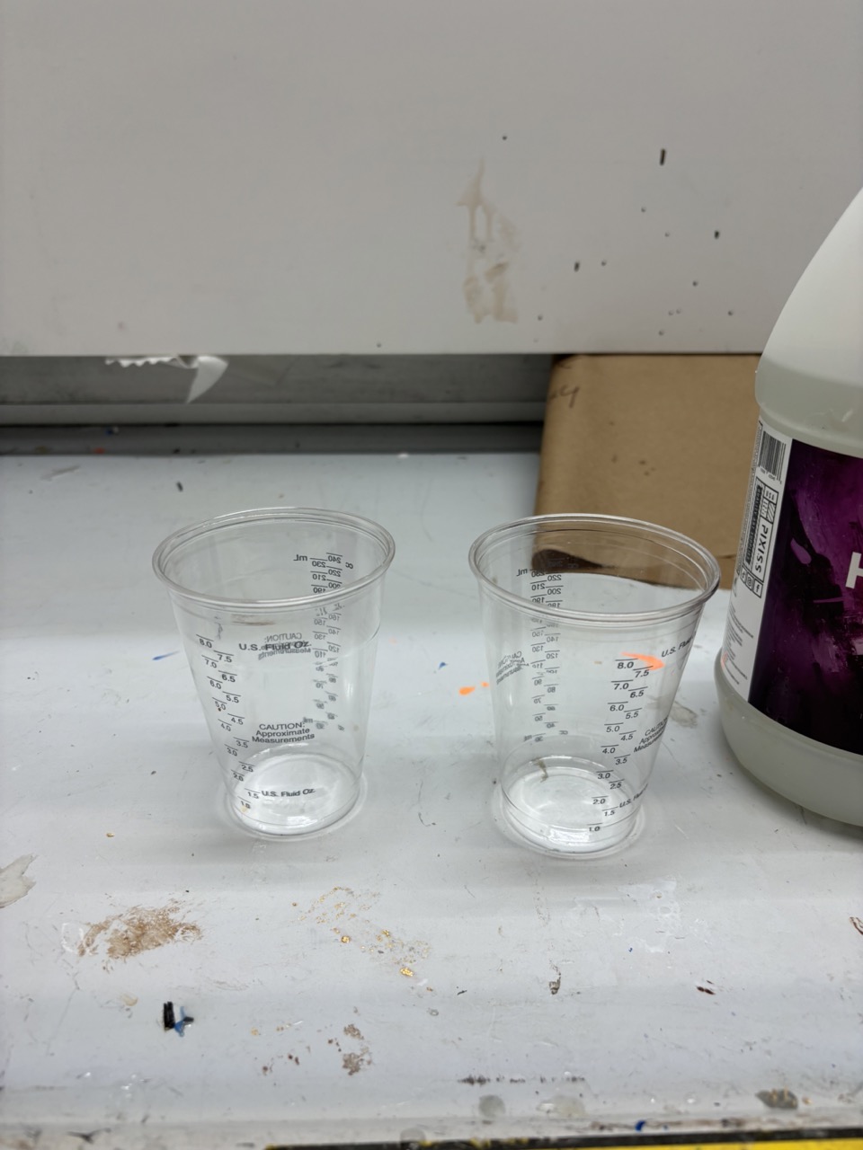A clear cup of resin and hardener