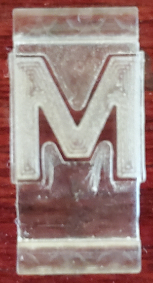 M milled with clear acrylic