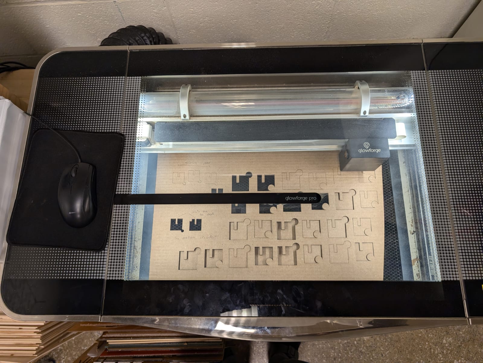 image of laser cutter cutting the designs