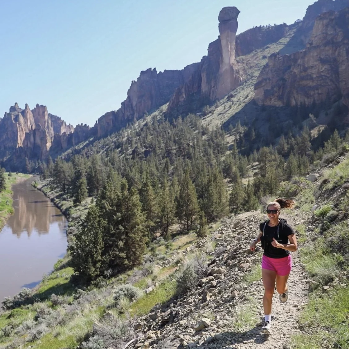 Sara running in a natural landscape