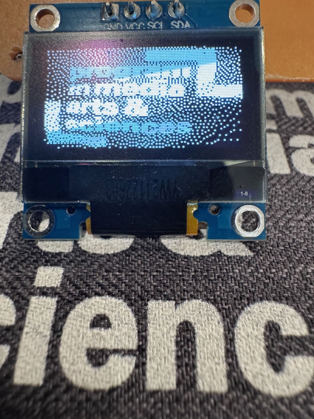 PCB camera image of the text 'program in media arts & sciences'.