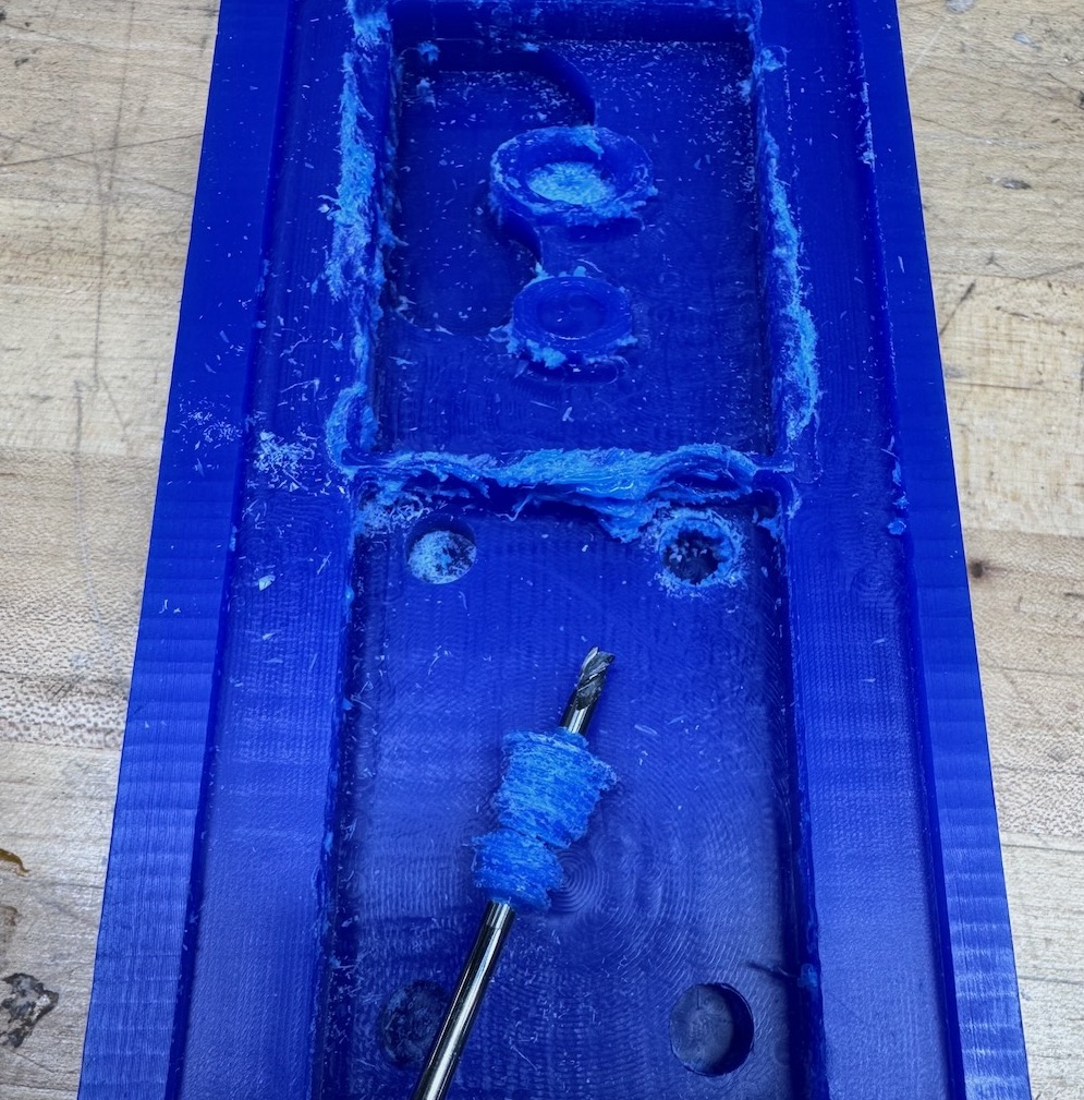 Machining failure due to accumulation of wax on the bit.
