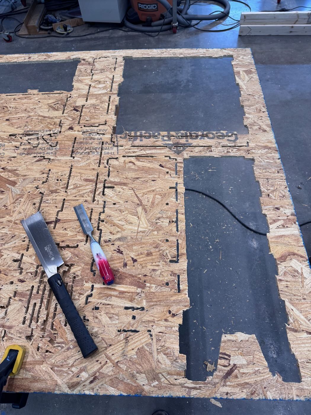 Cutting out parts with saw and chisel.