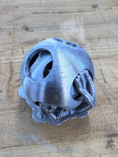 Printed puzzle ball with supports.