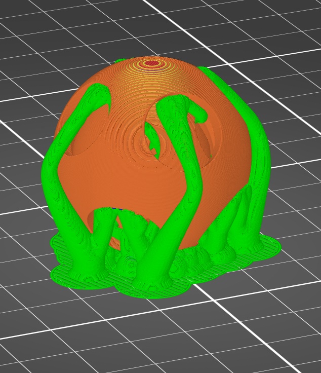 Supports (green) and the puzzle ball (orange) in the Slicer software.