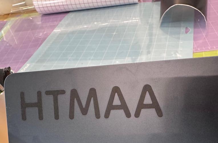 HTMAA sticker on laptop.