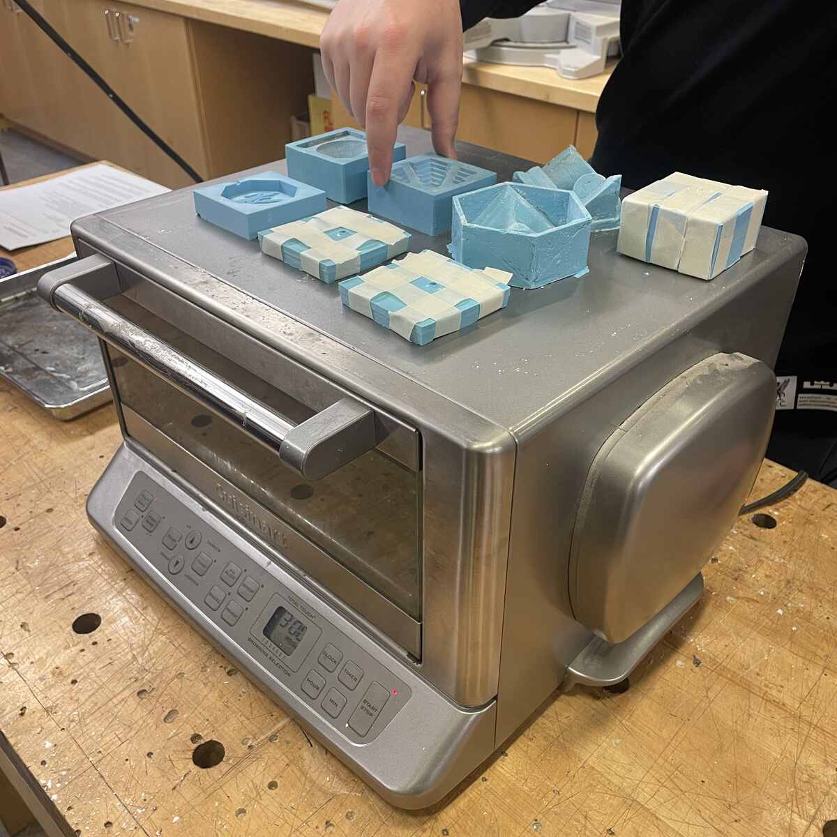 It helps for to heat up Silicone before on top of oven esp. 2 part molds