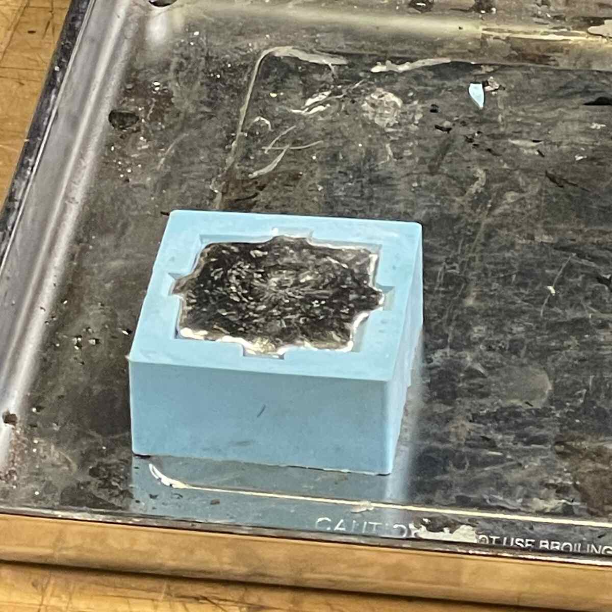 It helps for to heat up Silicone before on top of oven esp. 2 part molds