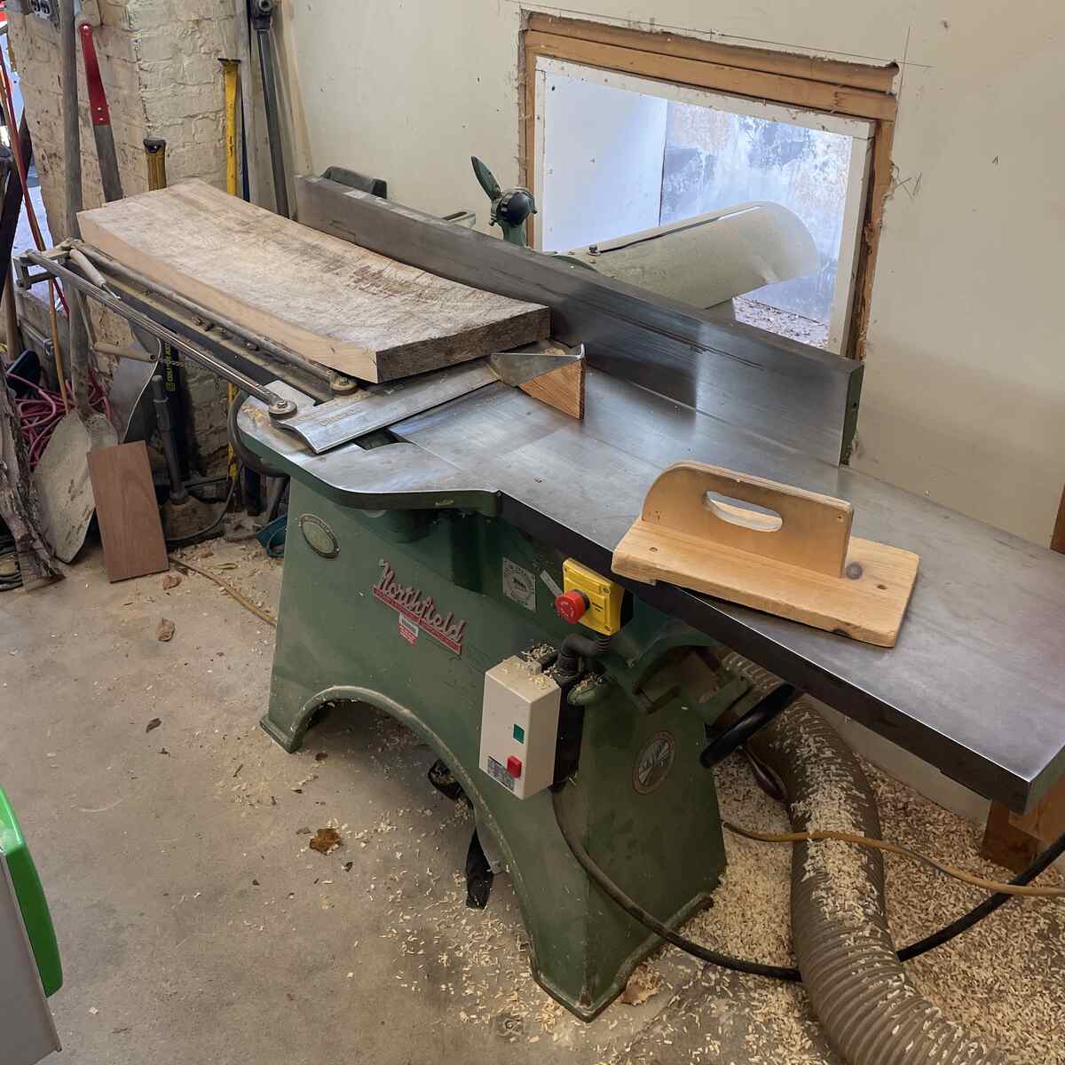 Using the joiner to plane the first face