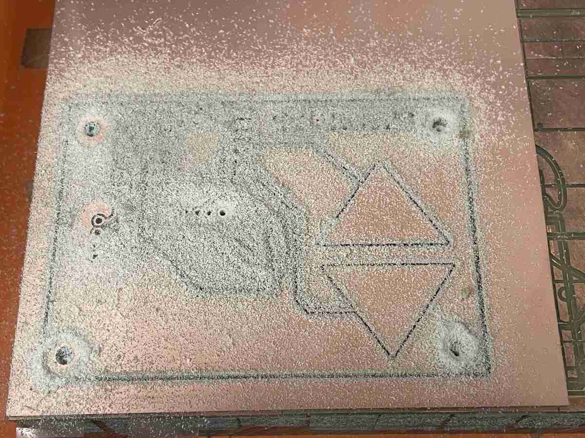 Starting to cut the copper traces. This seemed to be the right amount of "chipping" residue according to Gert and means things are running smoothly.