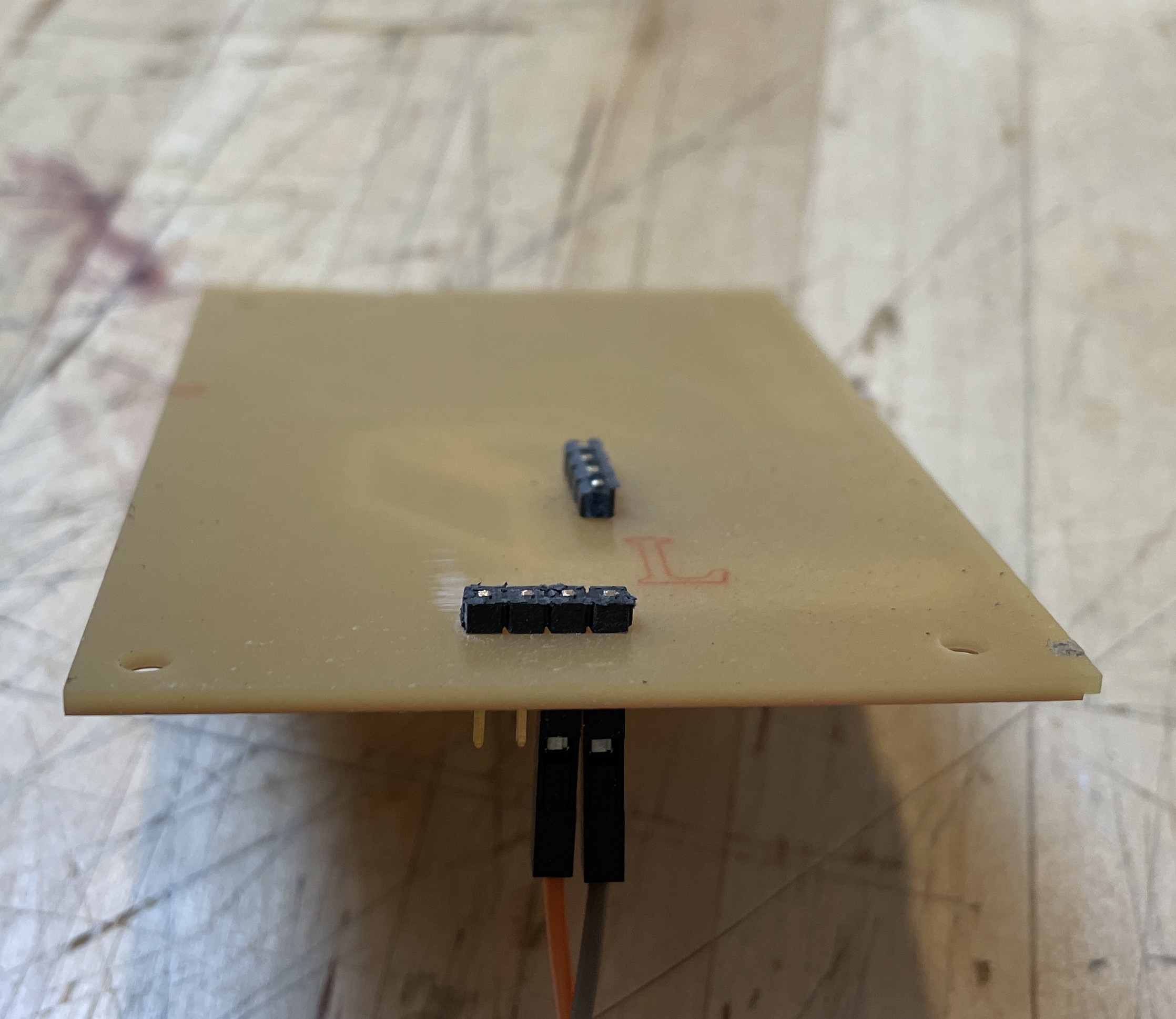 Placing the screen down on the pins