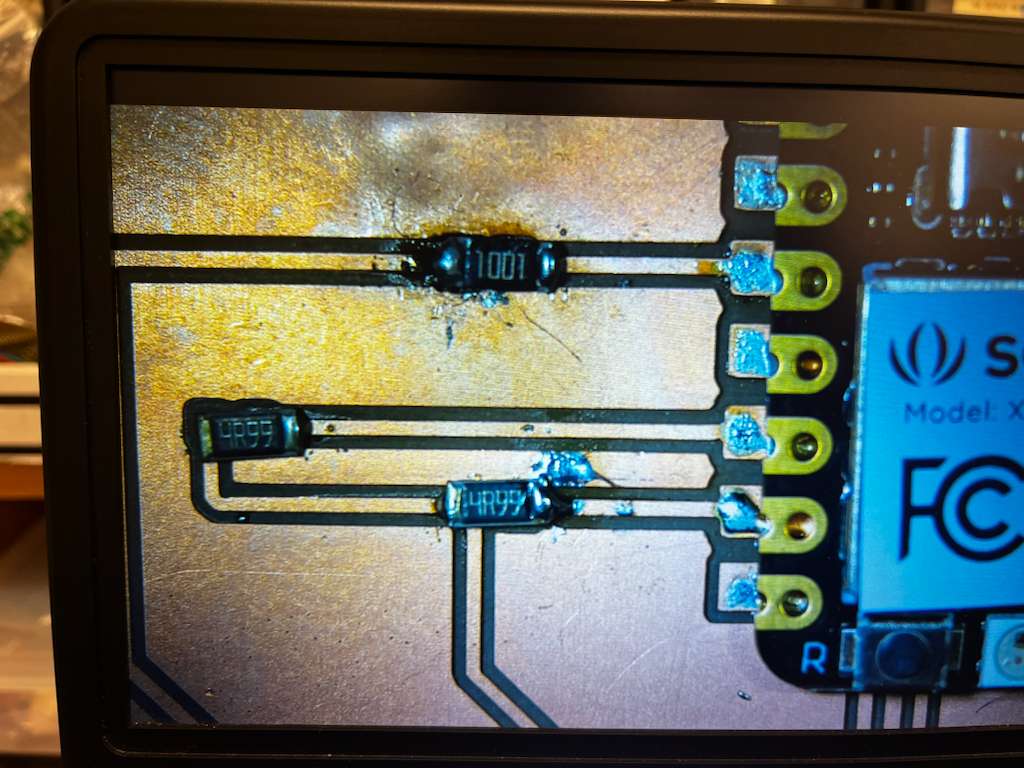Microscope view of messy solder joints