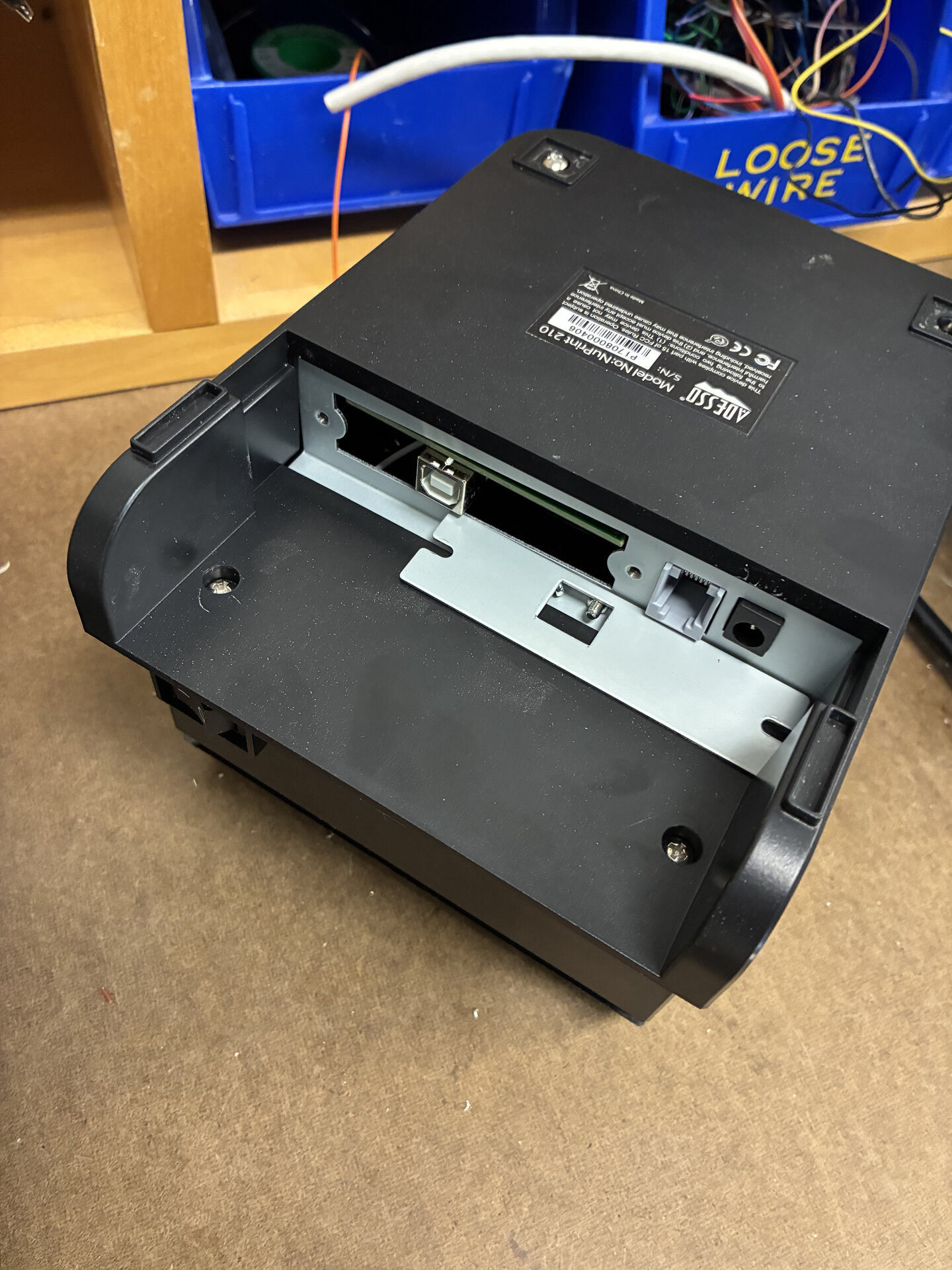 For this project I wanted to retrofit an old device with cutting edge software and leave it looking as inconspicuous as possible, like the trend of sleeper build computers. I want there to be an element of magic or fantasy in an old device inexplicably having modern capabilities. That's why, when I found this old ESC/POS point of sale machine in a mail room trash center, I knew it would be perfect for my work.