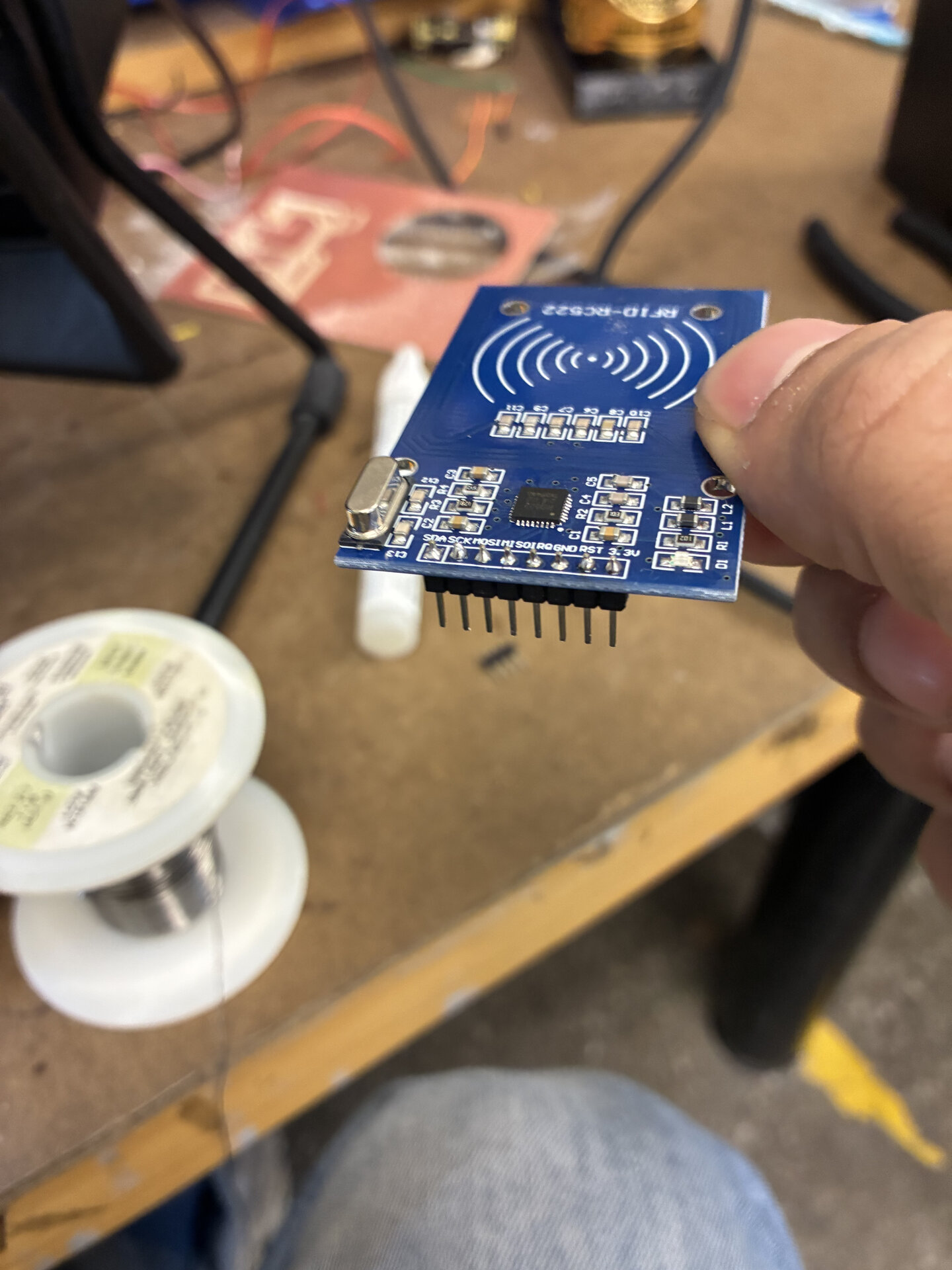 Soldering male headers onto my RFID reader.