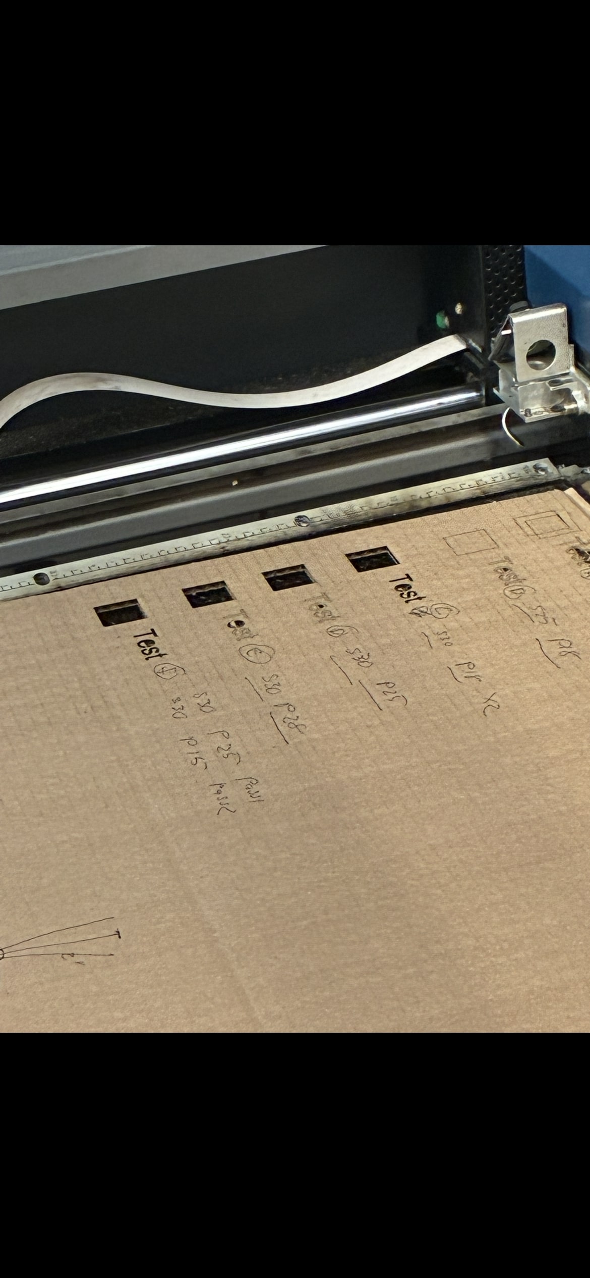 Close-up of engraved and cut samples from early tests