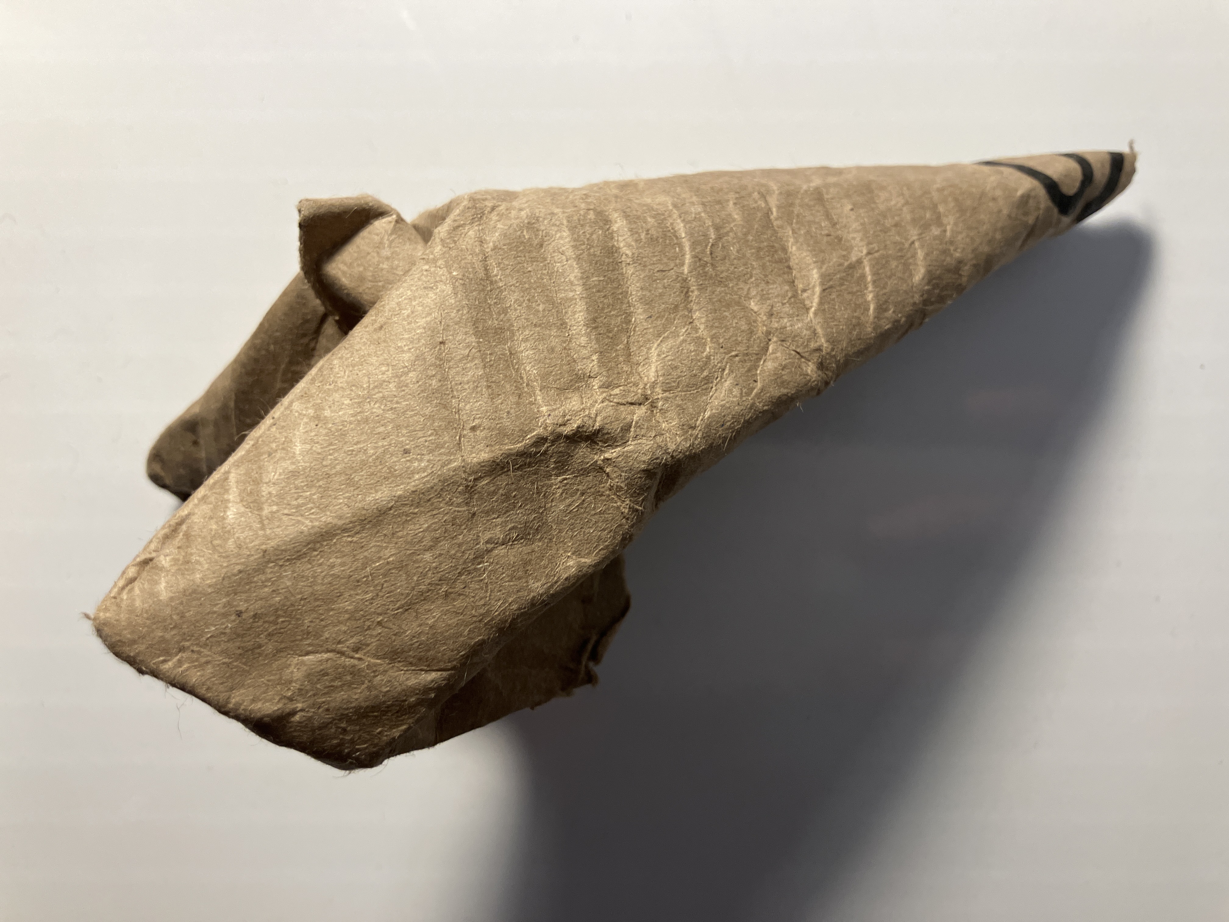 Hand‑folded single gadget — side view