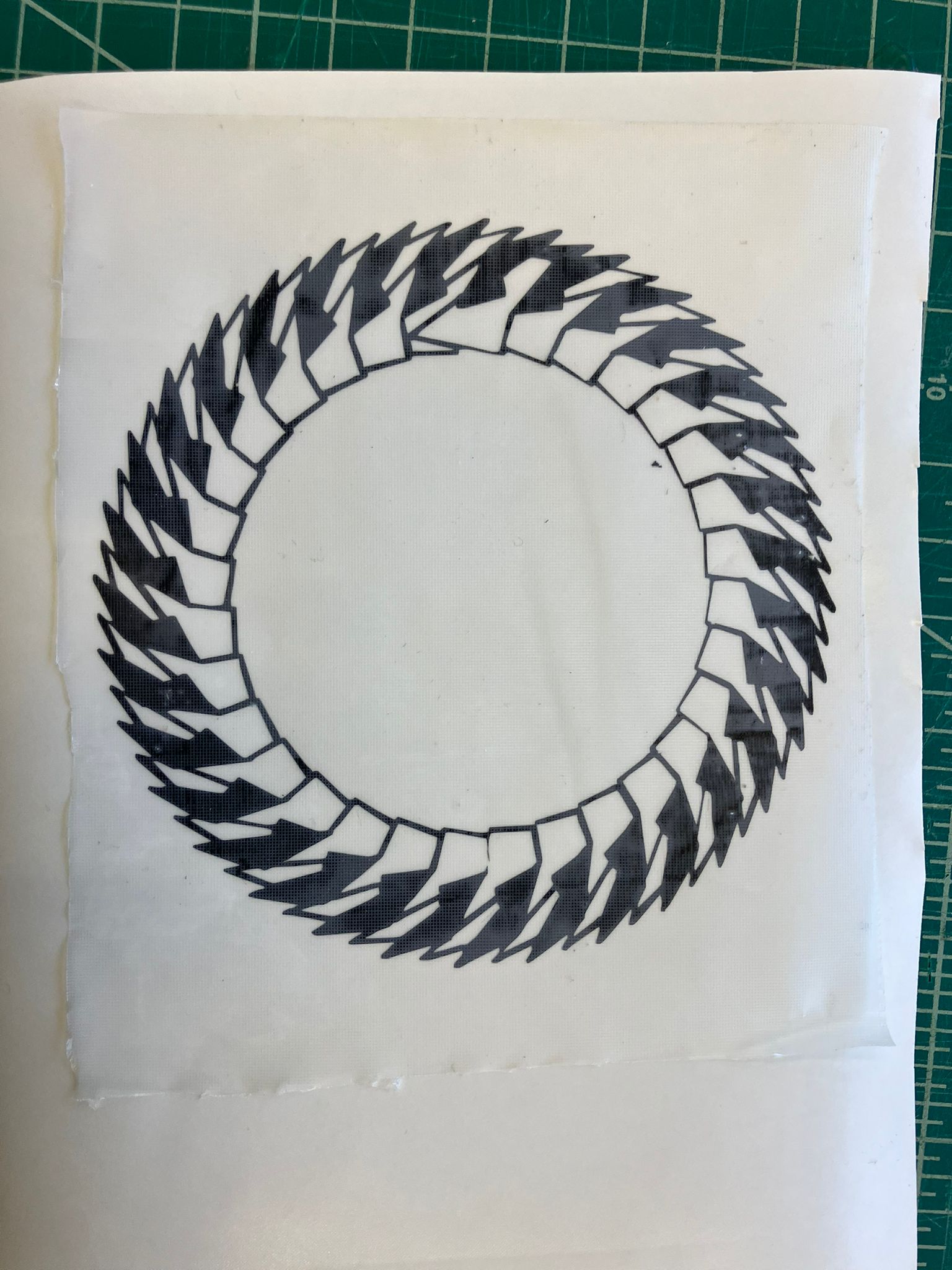 Applying transfer paper to weeded vinyl