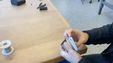 Spring loaded phone holder animation