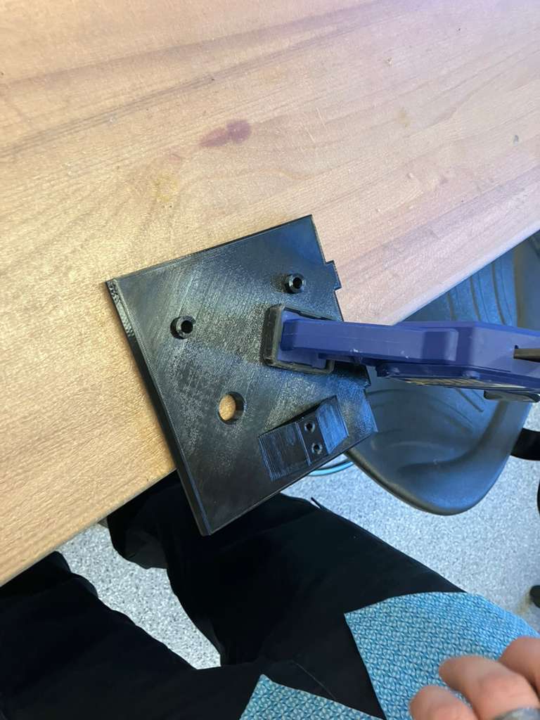 Printed part clamped for drilling load cell mounting holes