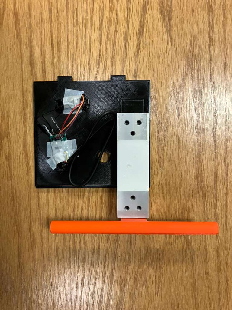 Photo of the fully assembled grip strength device with electronics and handle