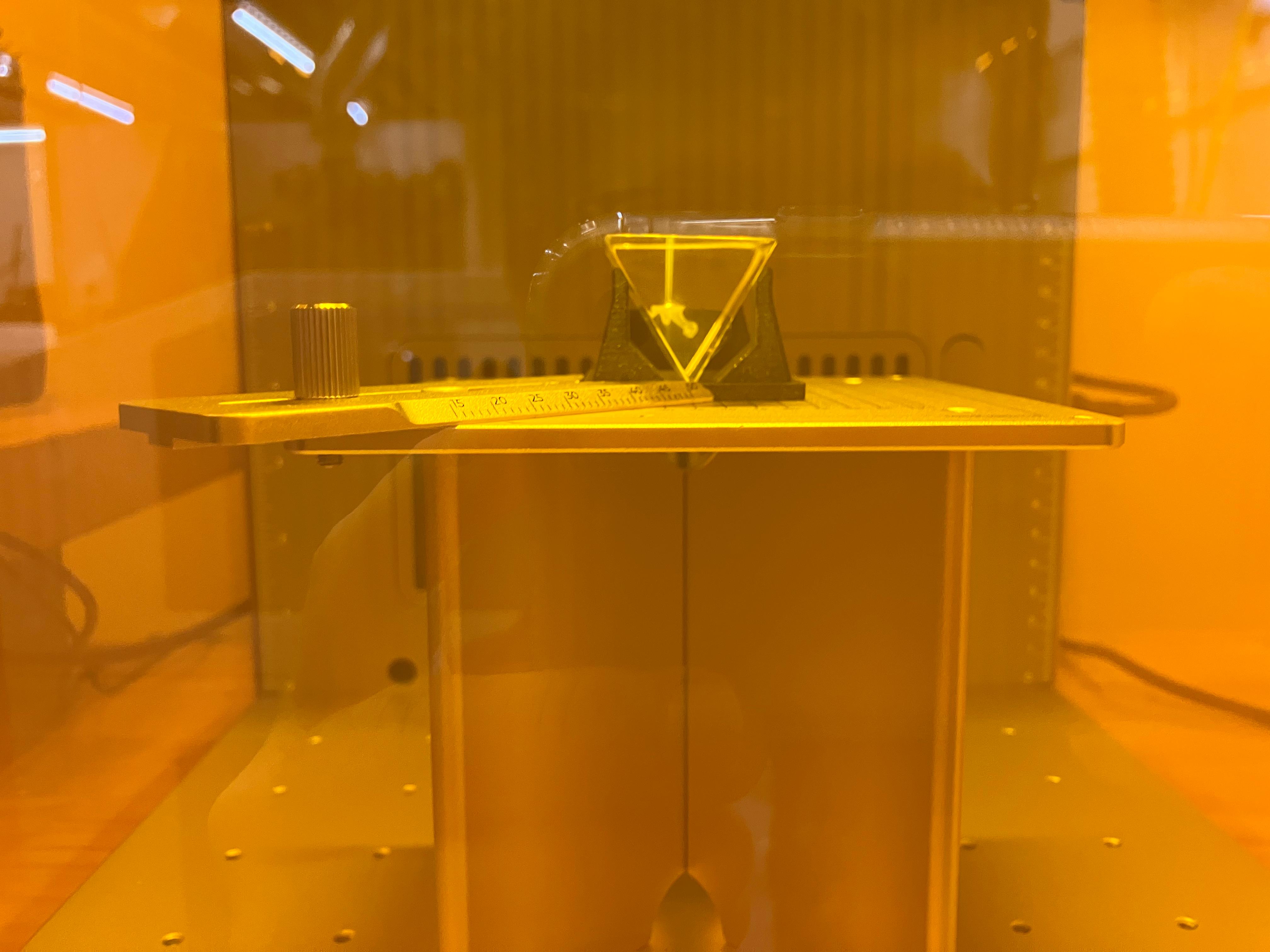 Dinosaur design being engraved in glass