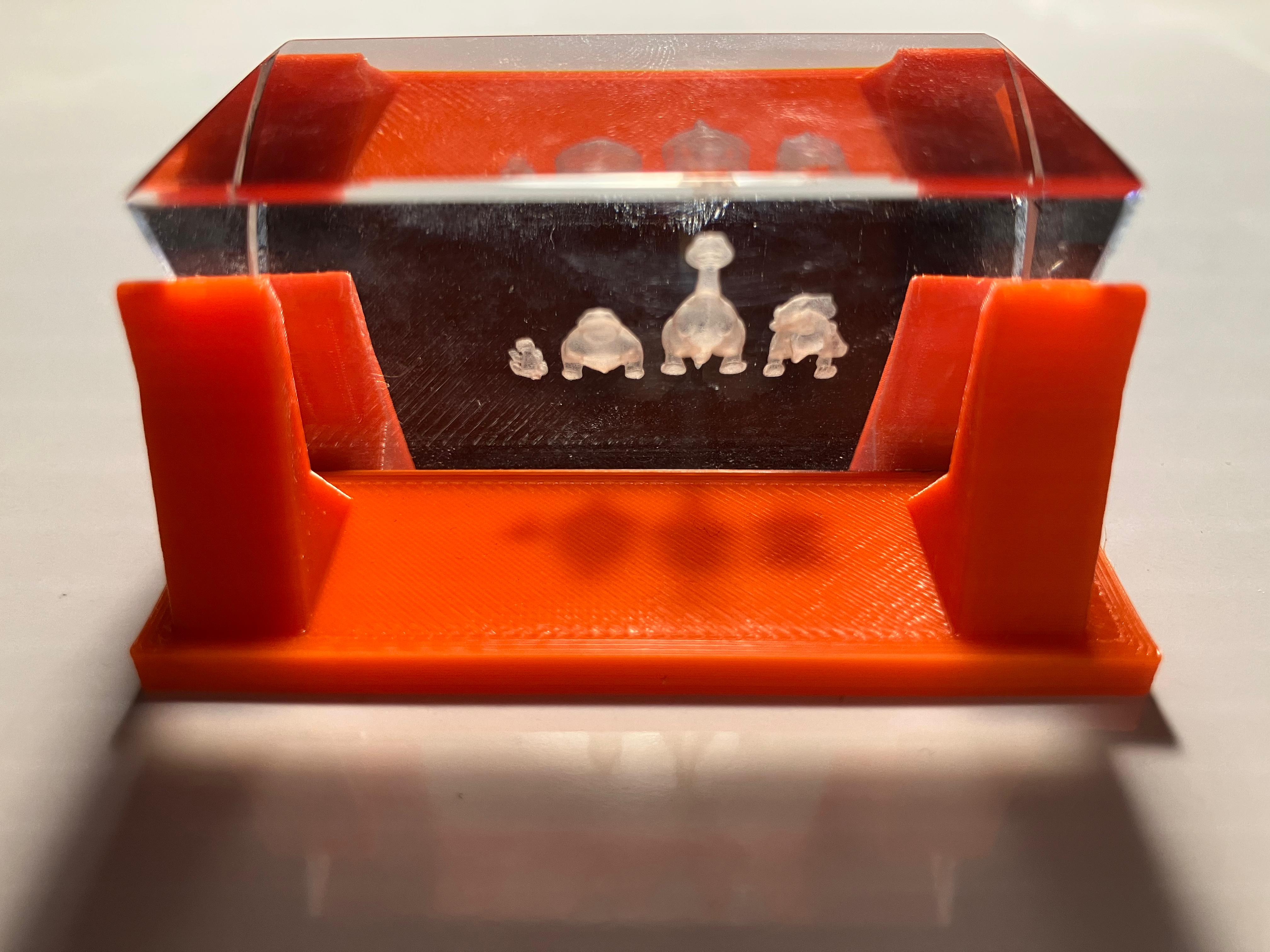 Engraved prism in 3D-printed holder