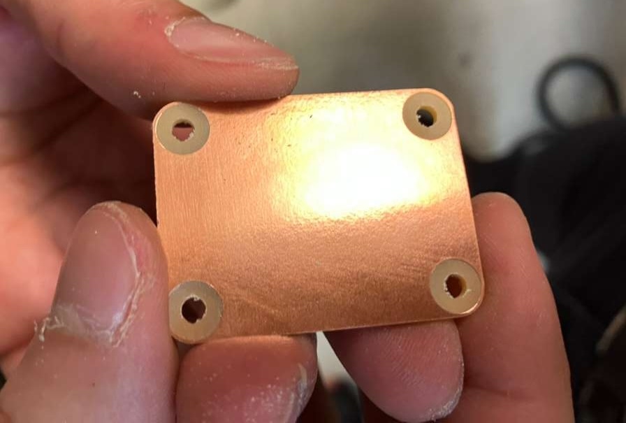 CNC milling process creating mounting holes in the PCB