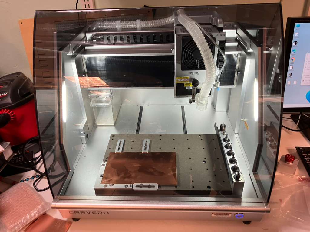 Copper-clad board fixtured for engraving