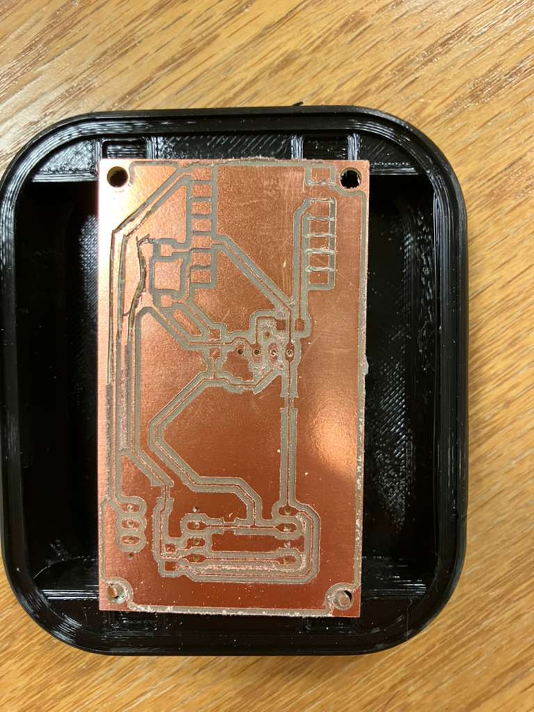 Board nearly fitting in casing showing dimensional constraints