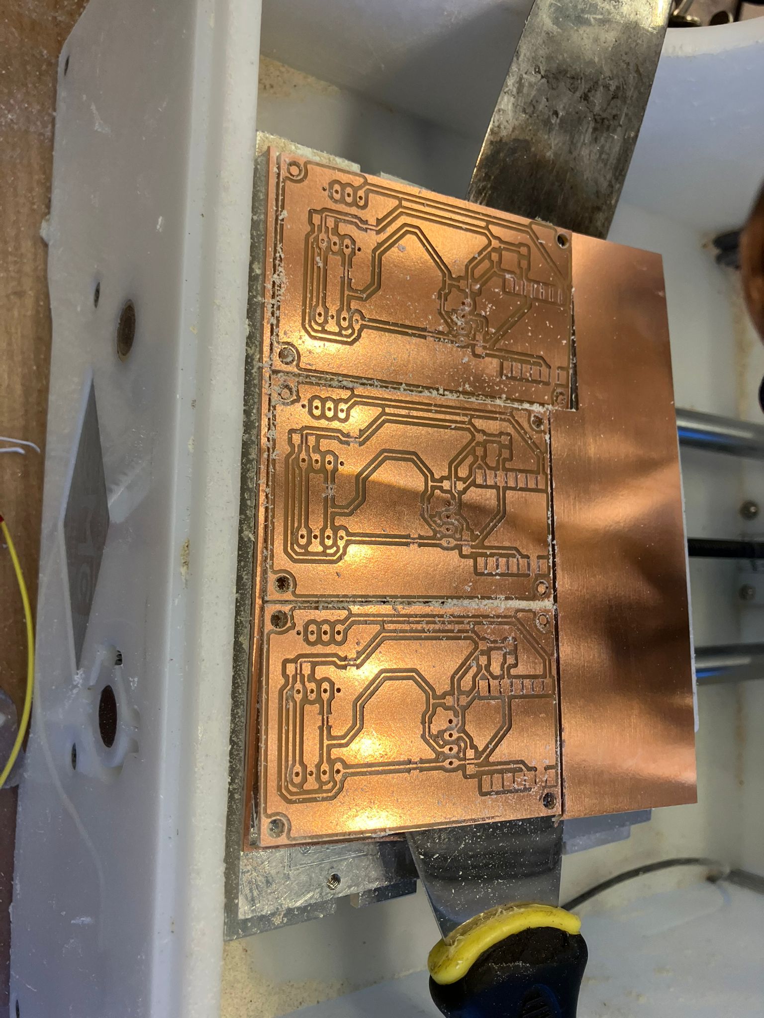 Removing completed aging clock board from mill