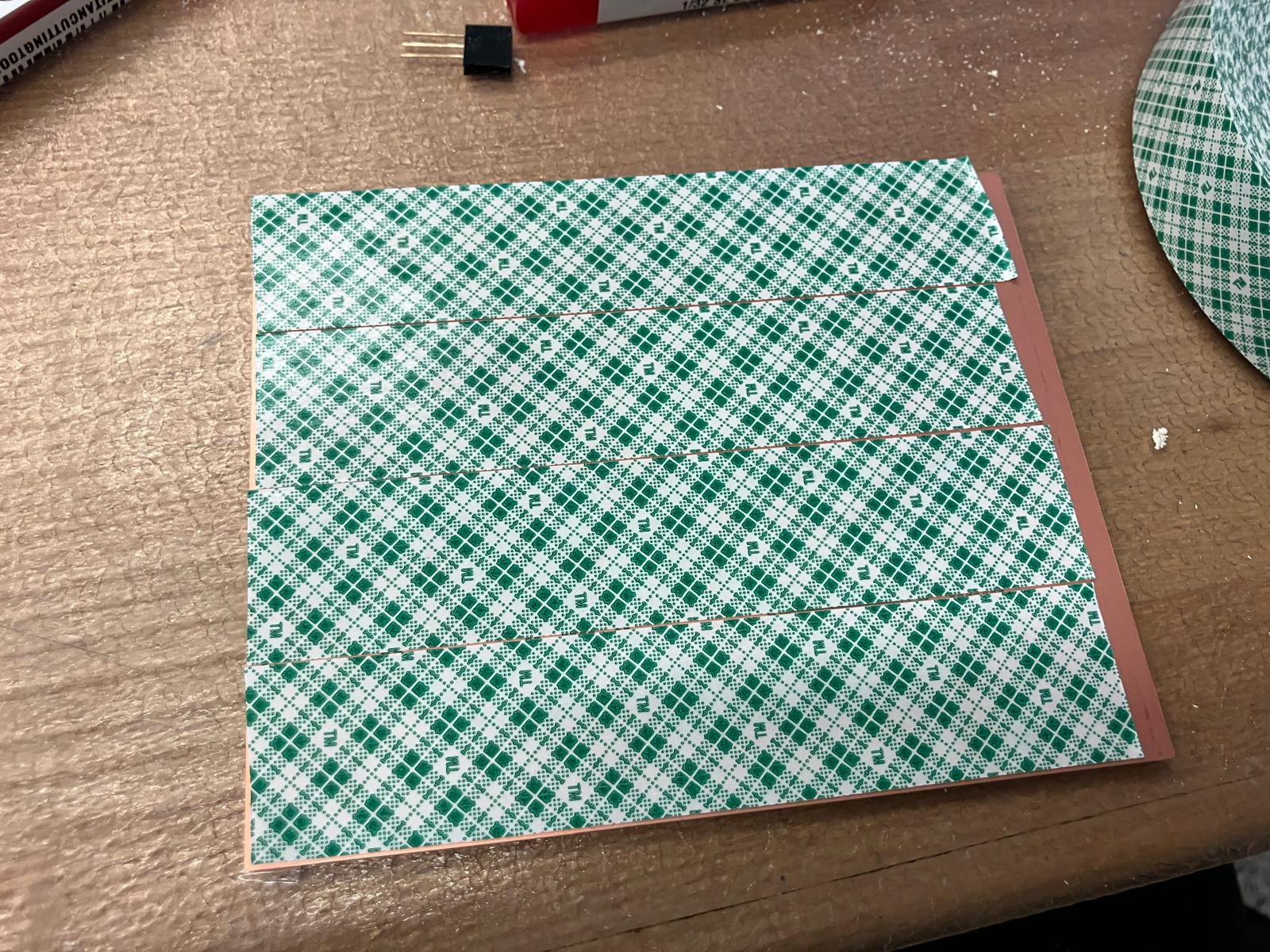 Double-sided taping for board fixturing