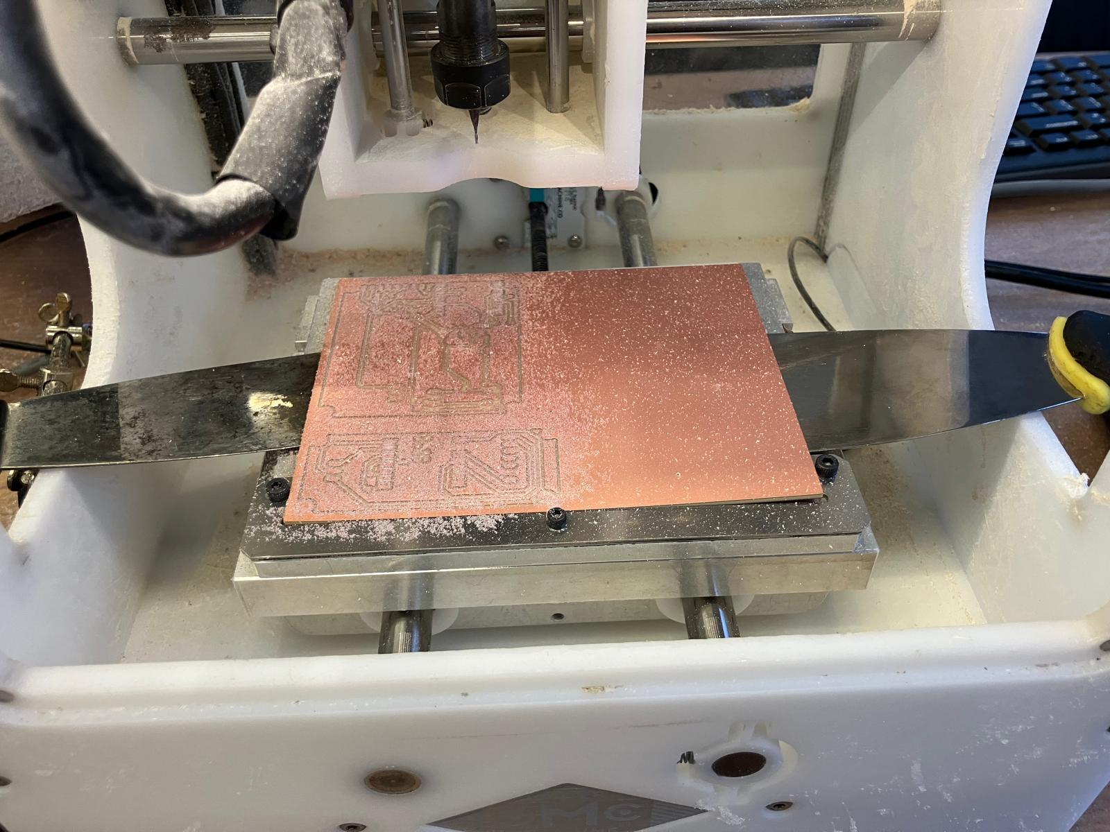 Removing milled PCB from machine