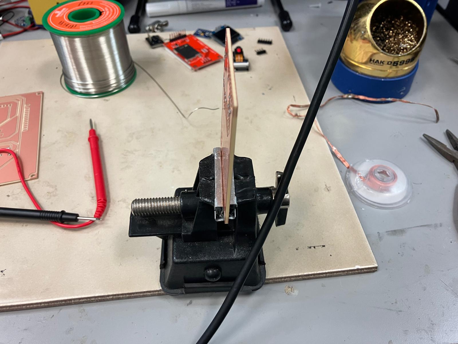 Close-up of dense double-sided soldering on the aging clock board