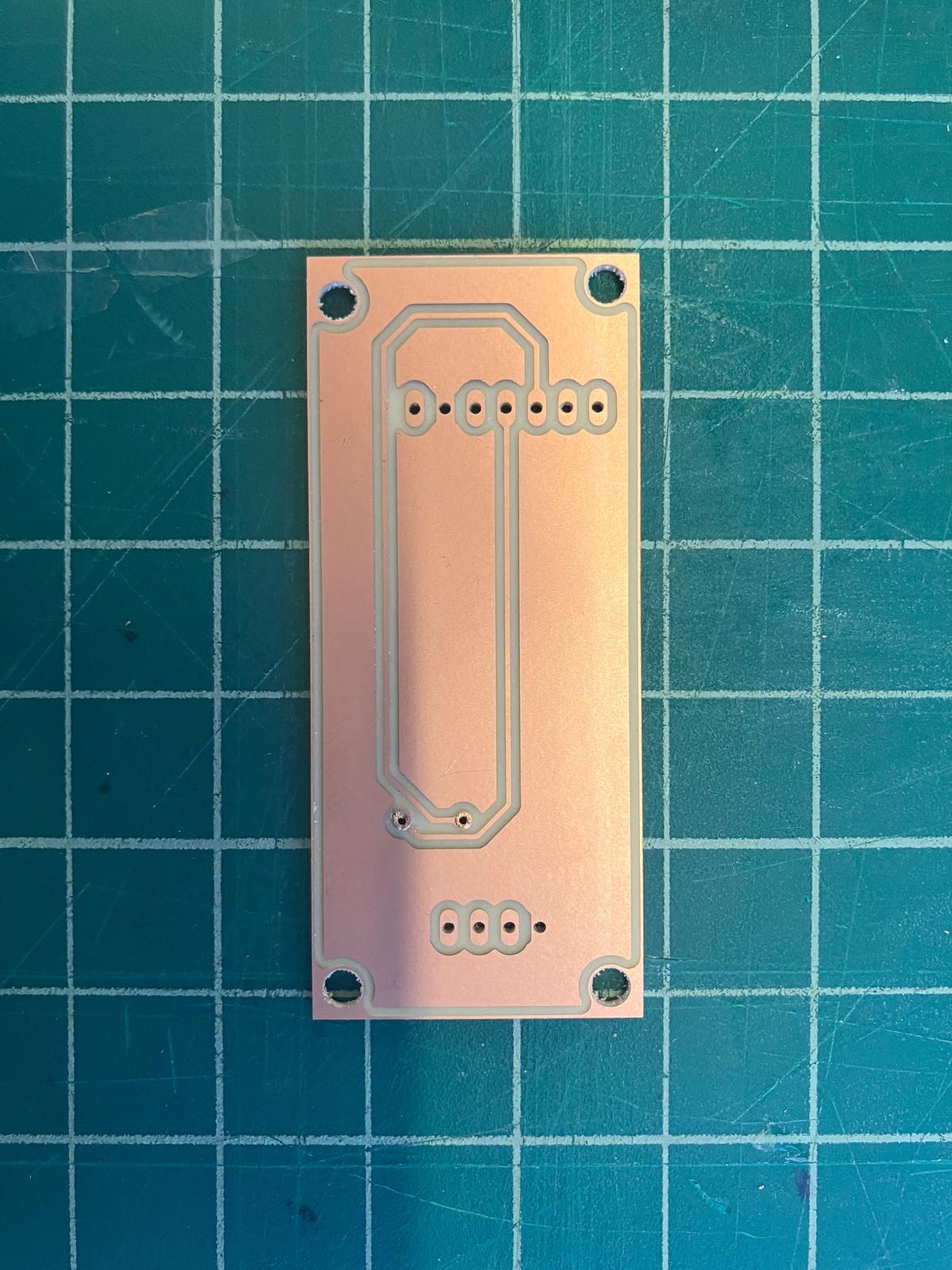 Back side of small MirrorAge board with completed rivets