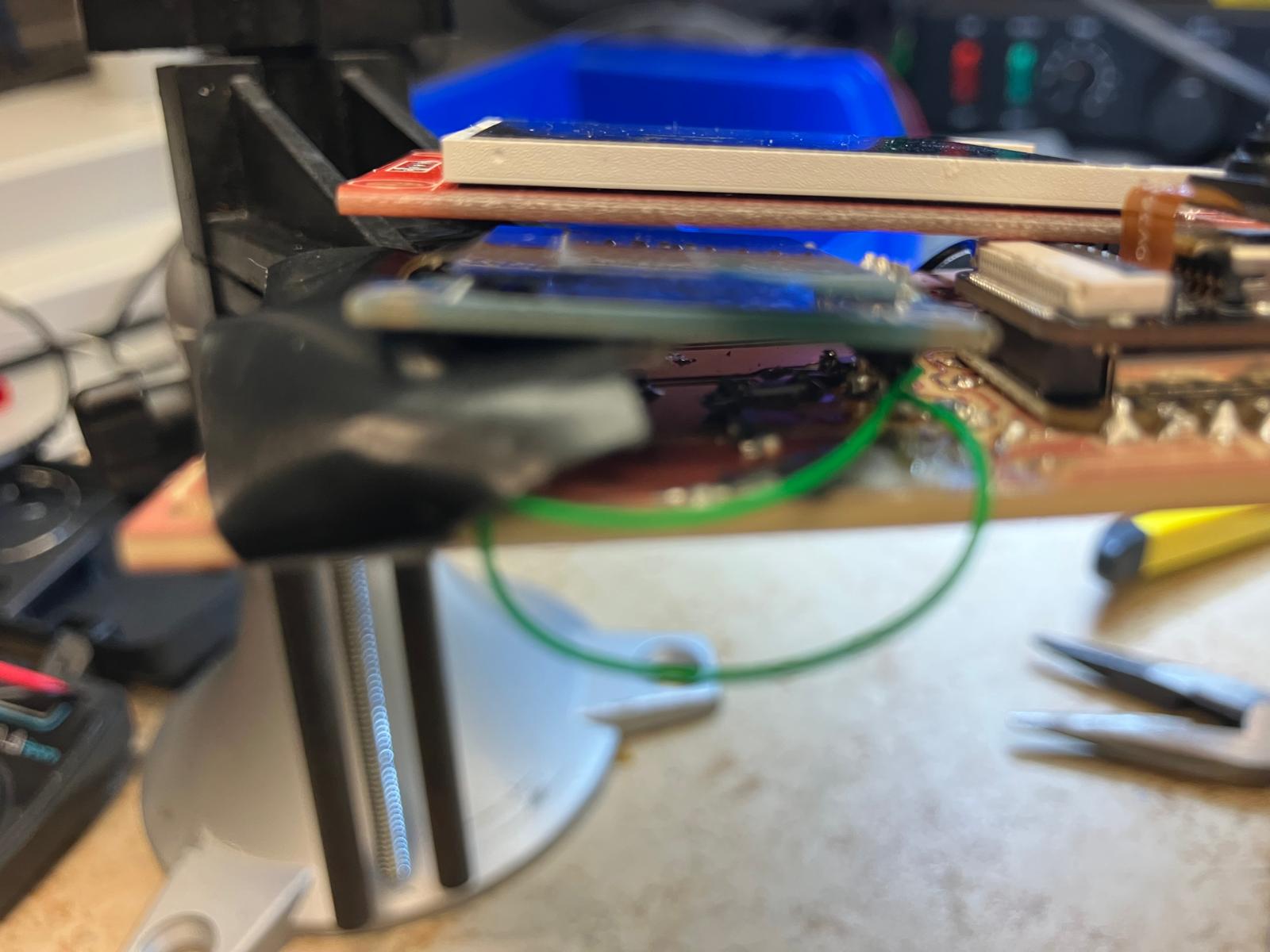 Routed cables inside the partially open watch enclosure