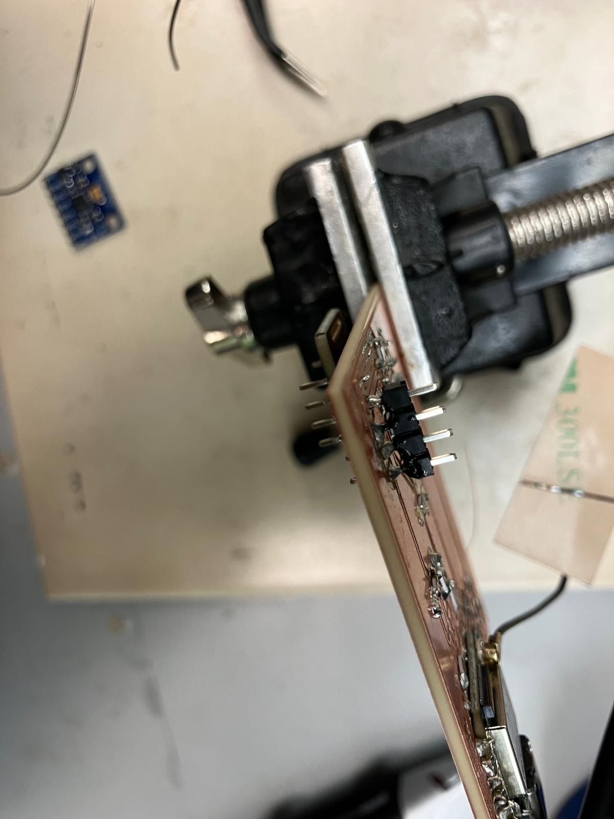 Board with pin headers soldered in preparation for system wiring