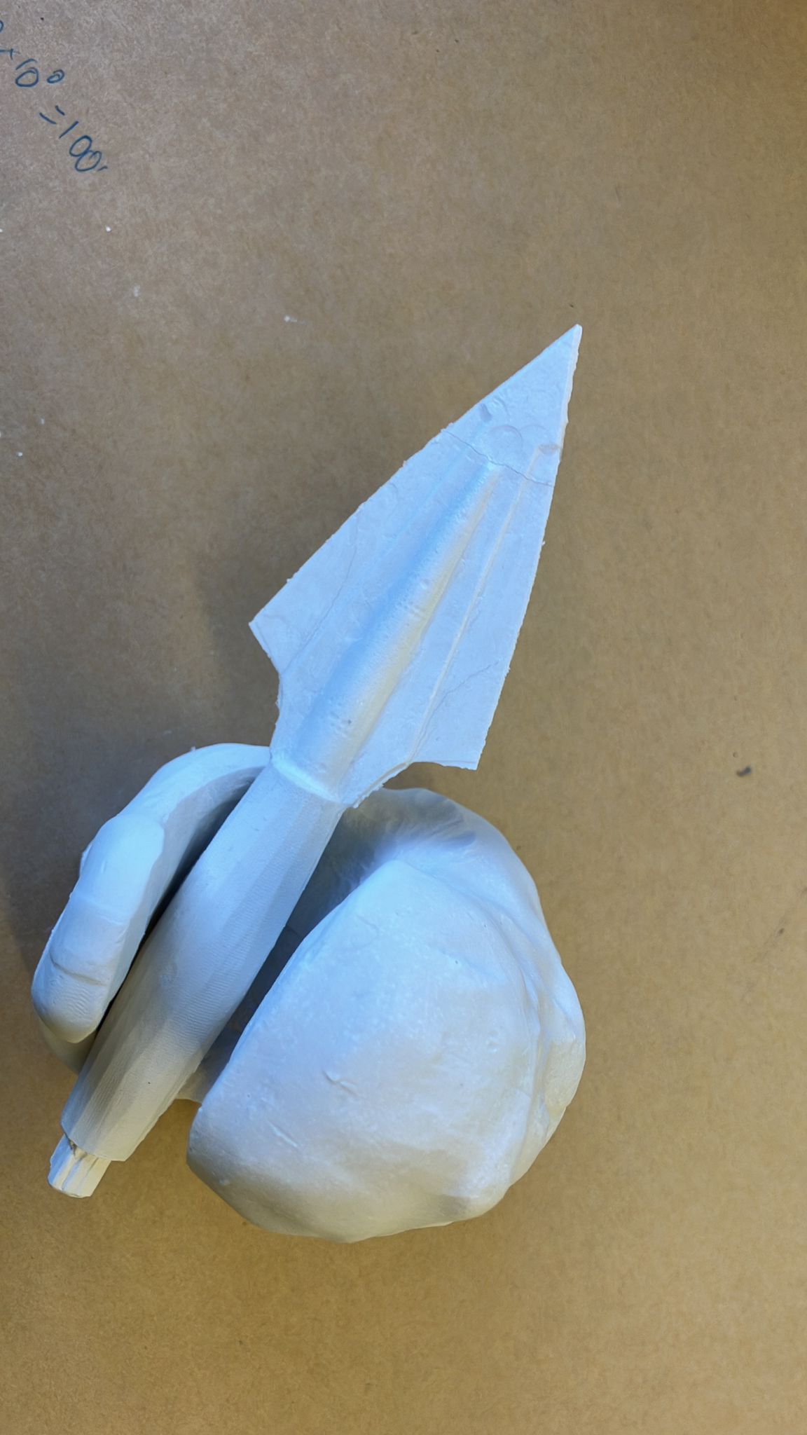 Arrow prop held next to the tyrannosaurus rock casting