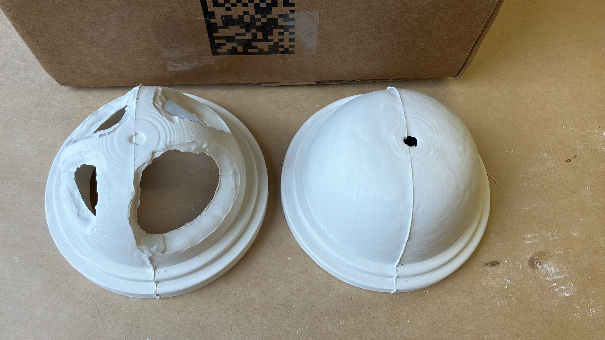 Finished base dome and topology optimized dome side by side after demolding