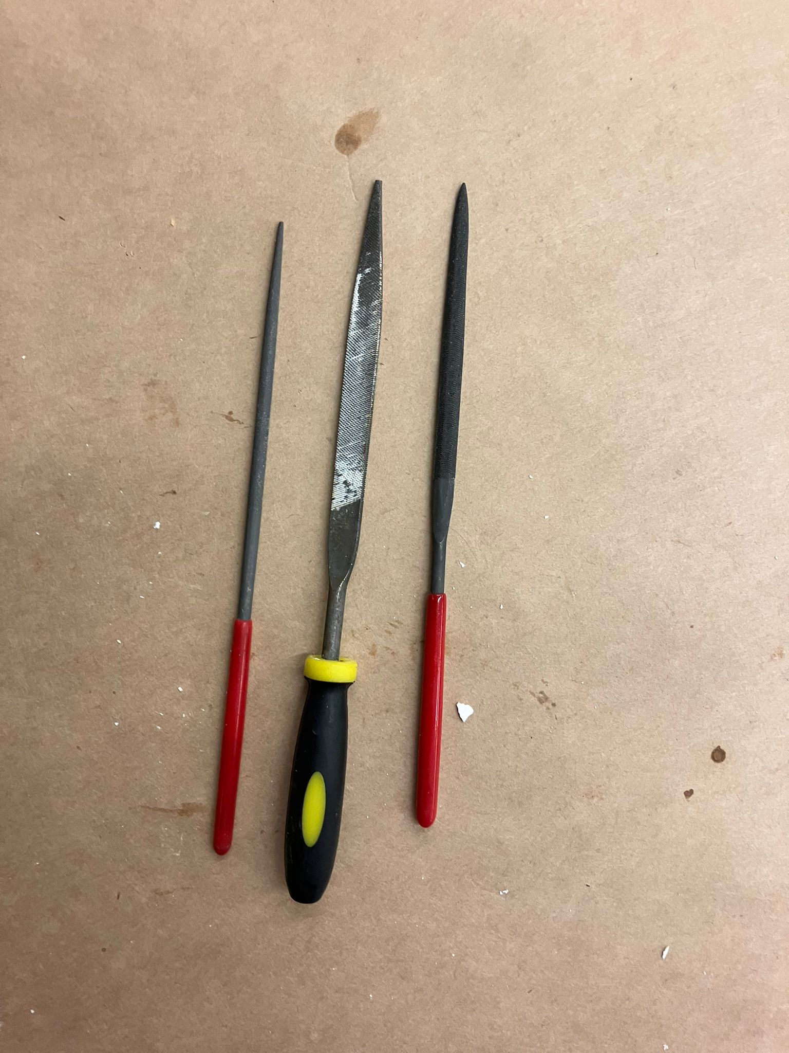 Set of files and sandpaper used to refine the arrow casting