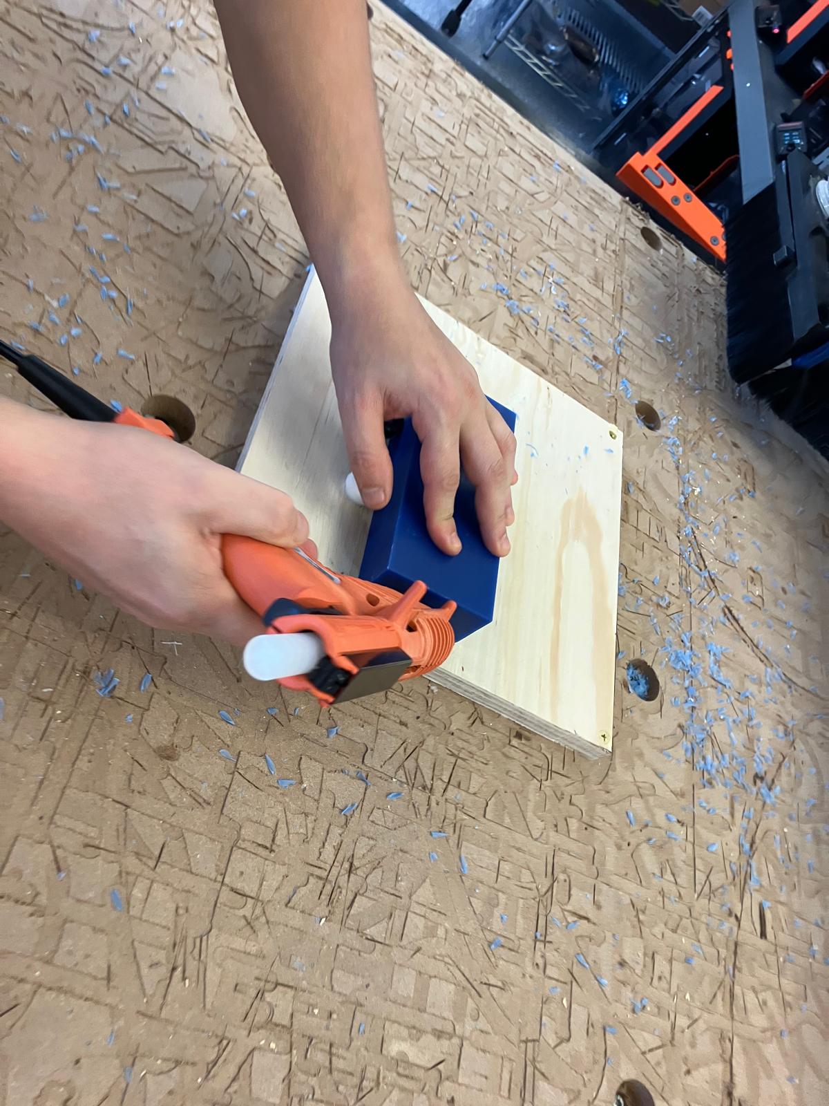 Preparing to fixture wax stock on the CNC bed